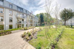Vonkajšia záhrada v ubytovaní 3 City apartments - Syma