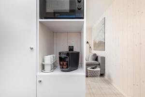 Příslušenství pro přípravu čaje a kávy v ubytování Bianco House Apartments