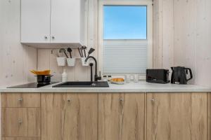 Kuchyň nebo kuchyňský kout v ubytování Bianco House Apartments