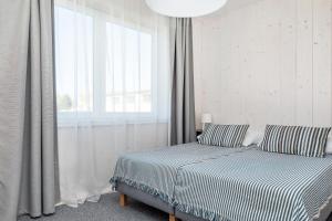 Postel nebo postele na pokoji v ubytování Bianco House Apartments