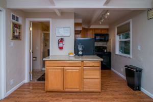 a kitchen with a island in the middle of a room at Cozy Hideaway B in Yosemite West