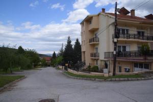 an empty street in front of a building at Petrograd in Bitola