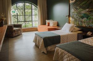 Cama ou camas em um quarto em Hotel Canto das Águas - Roteiro de Charme