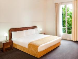 
Ένα ή περισσότερα κρεβάτια σε δωμάτιο στο Arni Hotel Domotel 

