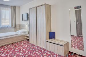 Ένα ή περισσότερα κρεβάτια σε δωμάτιο στο Hotel Arena
