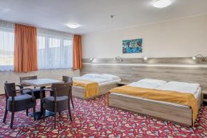 Ένα ή περισσότερα κρεβάτια σε δωμάτιο στο Hotel Arena