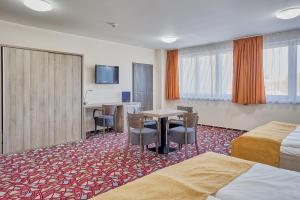 Ένα ή περισσότερα κρεβάτια σε δωμάτιο στο Hotel Arena