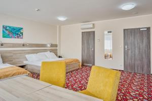 Ένα ή περισσότερα κρεβάτια σε δωμάτιο στο Hotel Arena