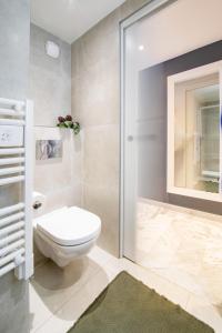 a bathroom with a toilet and a shower at Near Croisette- 4 Star Studio -SeaView in Cannes