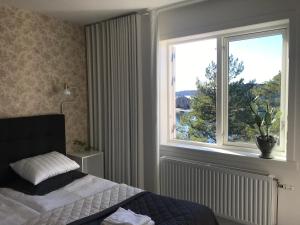 Postel nebo postele na pokoji v ubytování Sjövillan B&B