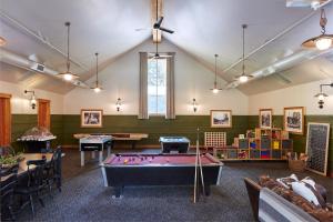 a billiard room with a pool table in the middle at Evergreen Lodge at Yosemite in Groveland