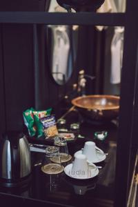 a kitchen counter with tea cups and a bowl at iuDia Hotel in Phra Nakhon Si Ayutthaya +37 photos
