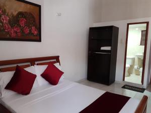 Letto o letti in una camera di Hotel Don Juan Colonial