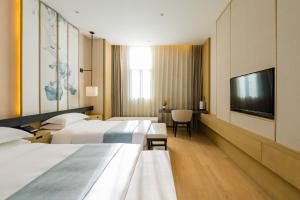 Letto o letti in una camera di Yun He Ye Bo Hotel (Shanghai International Tourist Resort Wild Animal Park)