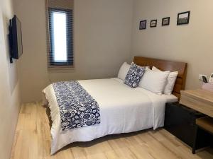 Voodi või voodid majutusasutuse Enjoy Homestay toas