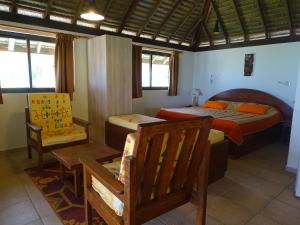 Ein Bett oder Betten in einem Zimmer der Unterkunft Hôtel Atiapiti