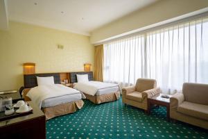 Katil atau katil-katil dalam bilik di 柳營尖山埤 Liuying Jianshanpi Resort
