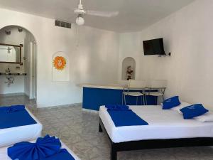 Ένα ή περισσότερα κρεβάτια σε δωμάτιο στο Hotel Paraíso Kora