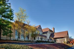 a large house with a building at Holiday Inn At Six Flags Saint Louis by IHG in Eureka