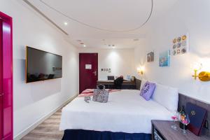Ένα ή περισσότερα κρεβάτια σε δωμάτιο στο Norway Forest Travel hotel 1 Taichung