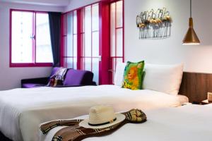 Ένα ή περισσότερα κρεβάτια σε δωμάτιο στο Norway Forest Travel hotel 1 Taichung