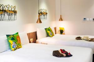 Ένα ή περισσότερα κρεβάτια σε δωμάτιο στο Norway Forest Travel hotel 1 Taichung