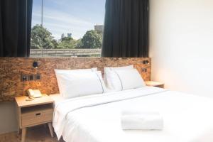 Postel nebo postele na pokoji v ubytování i-Hotel Kuala Lumpur