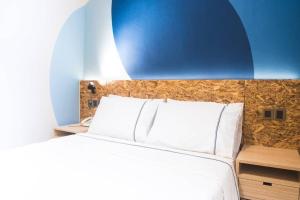 Postel nebo postele na pokoji v ubytování i-Hotel Kuala Lumpur