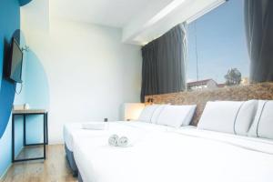 Postel nebo postele na pokoji v ubytování i-Hotel Kuala Lumpur
