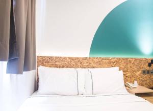 Postel nebo postele na pokoji v ubytování i-Hotel Kuala Lumpur