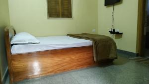 Postel nebo postele na pokoji v ubytování Nest Guest House