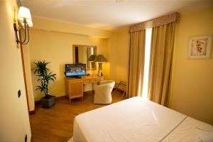 Postel nebo postele na pokoji v ubytování Uliveto Principessa Resort