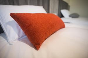 Postel nebo postele na pokoji v ubytování Long Fu Hotel