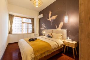 Ένα ή περισσότερα κρεβάτια σε δωμάτιο στο Guangzhou Tianhe District·Tianhe another city·
