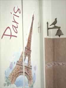 a picture of the eiffel tower on a wall at Anna Apartment in Braşov