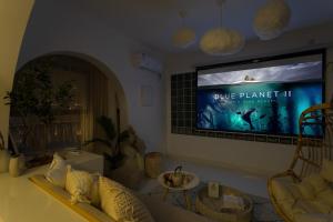 a living room with a couch and a tv on the wall at Wuhan City Wuchang District shahu park in Hankou