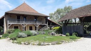 a house with a garden in front of it at Gite Evidence in Varennes-sur-le-Doubs