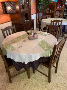 a table with a basket on top of it at Albergo Casa Lupi in Guidonia