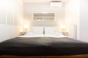 Postel nebo postele na pokoji v ubytování Hotel Maroli Mikulov