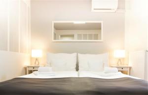 Postel nebo postele na pokoji v ubytování Hotel Maroli Mikulov