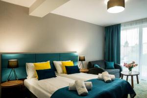 Postel nebo postele na pokoji v ubytování STELLA Resort & SPA