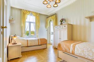 Vuode tai vuoteita majoituspaikassa Apartmán Nostalgia
