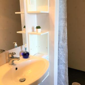 a bathroom with a sink and a shower at STF Jädraås Herrgård in Jädraås +33 photos