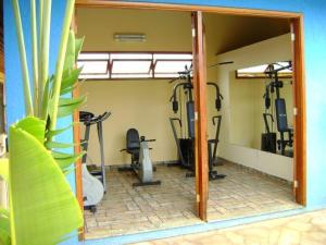 a gym with several exercise bikes in a room at Hotel Urubupunga in Ilha Solteira