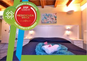 Postel nebo postele na pokoji v ubytování Residenza Vinci Room & Suite