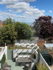a view of a garden with tables and chairs at Beresford81 in Cowes