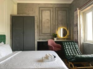 Postel nebo postele na pokoji v ubytování Dylan Hotel