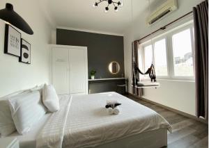 Postel nebo postele na pokoji v ubytování Dylan Hotel