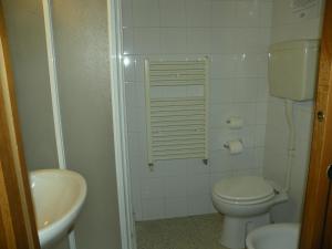 a small bathroom with a toilet and a sink at Affittacamere Casadio in Cotignola +11 photos