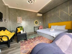Postel nebo postele na pokoji v ubytování Dylan Hotel